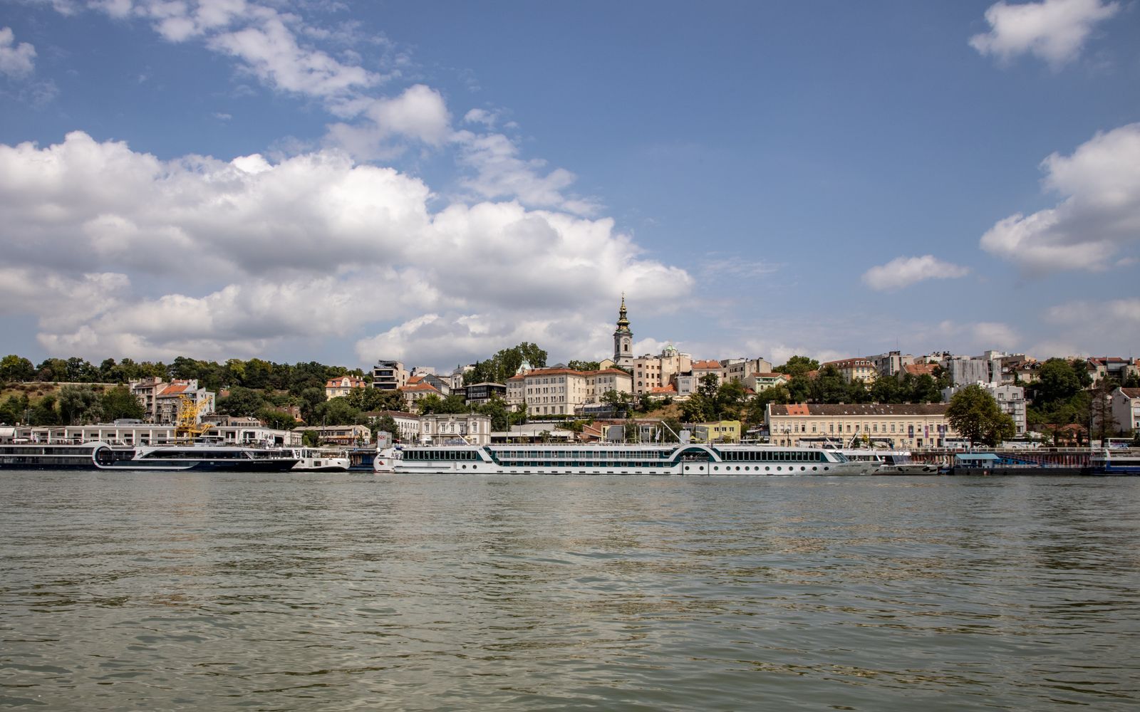 Belgrade old town skyline and Sava River waterfront with boats, Serbia