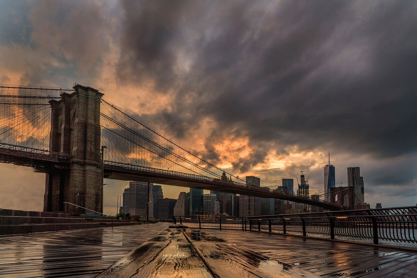 Brooklyn Bridge and the Lower Manhattan skyline at sunset seen from Brooklyn Bridge Park