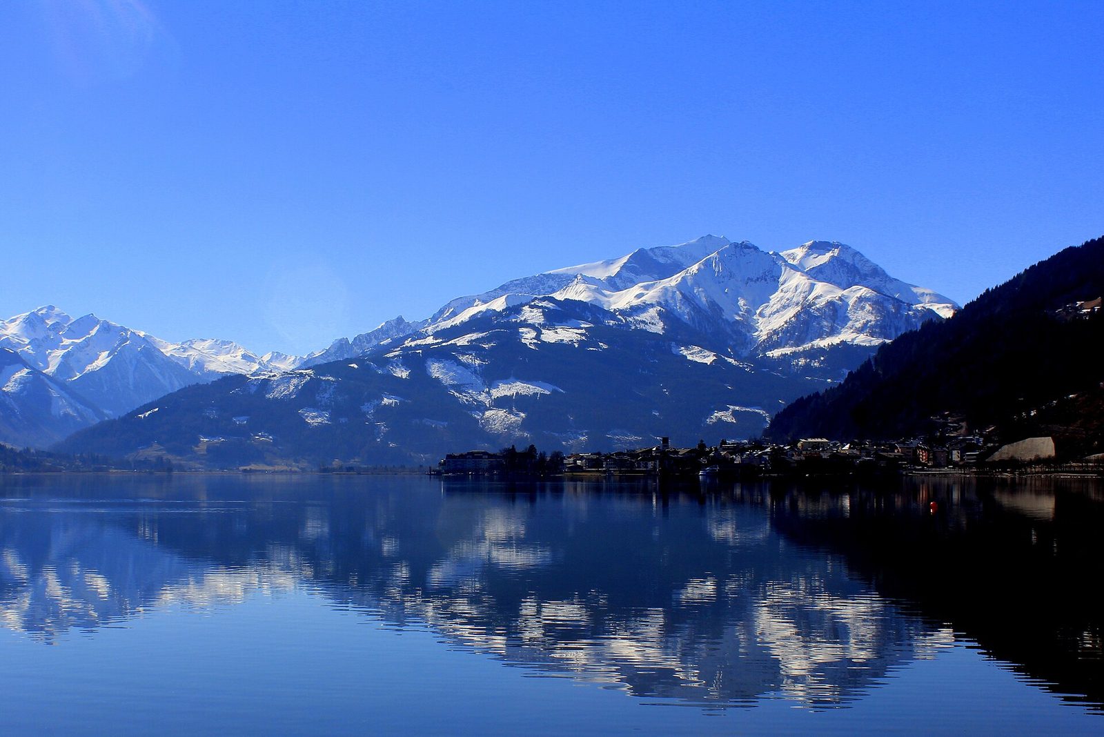 Zell am See lake and the Alps, Austria, a popular summer destination for Gulf families