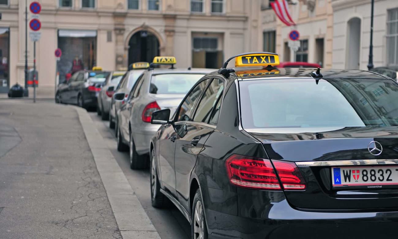 Vienna taxis with TAXI roof signs lined up on a city street